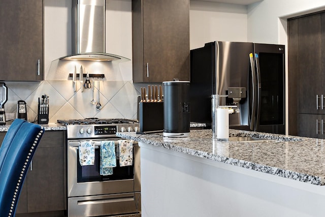 521 Bermuda Ave, Lancaster, TX 75146 - kitchen featuring appliances with stainless steel finishes, island exhaust hood, dark brown cabinetry, tasteful backsplash, and light stone countertops