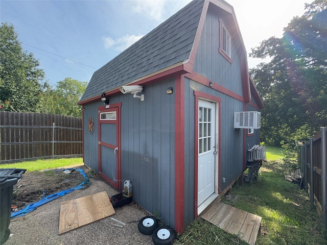 2720 Dorothy Dr, Keene, TX 76031 - view of outdoor structure with an AC wall unit and a fenced backyard