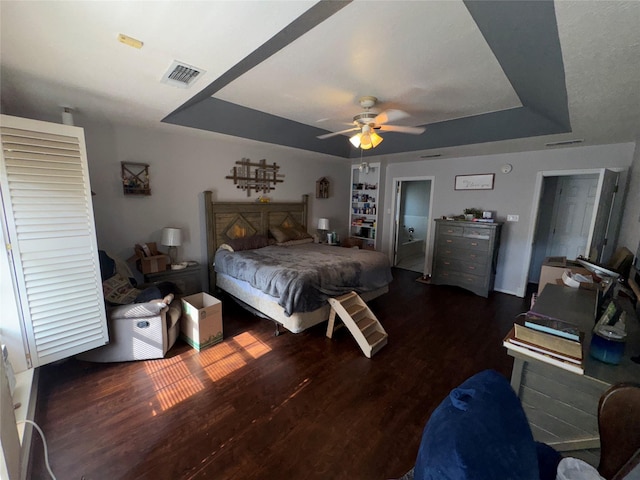 2720 Dorothy Dr, Keene, TX 76031 - bedroom with a tray ceiling, wood finished floors, and a ceiling fan