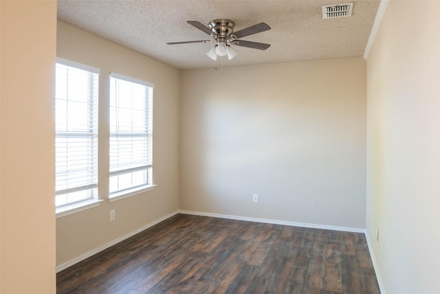 1565 Laurel Hall Ln, Little Elm, TX 75068 - empty room featuring ceiling fan, dark wood-style flooring, and a textured ceiling