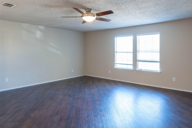 1565 Laurel Hall Ln, Little Elm, TX 75068 - empty room featuring a ceiling fan, dark wood-style floors, and a textured ceiling