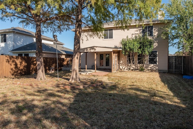 1565 Laurel Hall Ln, Little Elm, TX 75068 - back of house with french doors, a fenced backyard, and a patio area
