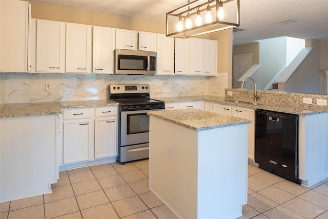 1565 Laurel Hall Ln, Little Elm, TX 75068 - kitchen featuring appliances with stainless steel finishes, a peninsula, light tile patterned floors, tasteful backsplash, and white cabinetry