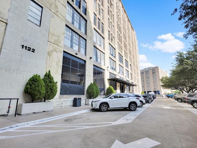 1122 Jackson St Unit 1103, Dallas, TX 75202 - view of apartment building / complex with uncovered parking