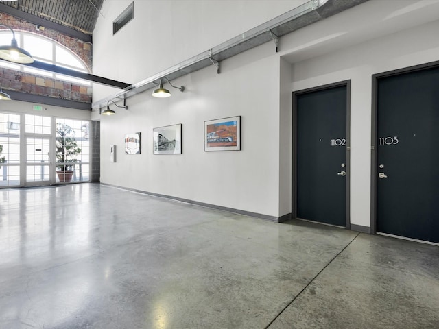 1122 Jackson St Unit 1103, Dallas, TX 75202 - garage featuring baseboards
