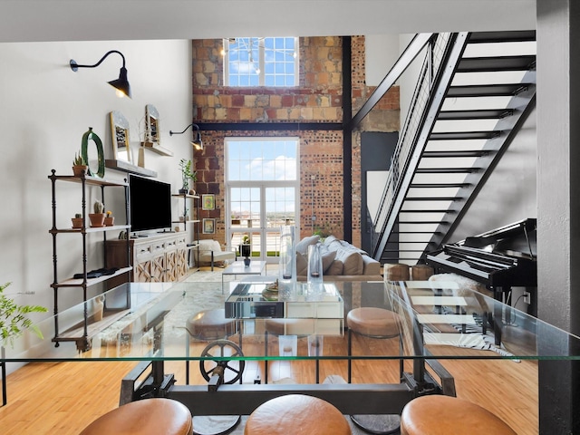 1122 Jackson St Unit 1103, Dallas, TX 75202 - living area with stairway and wood finished floors