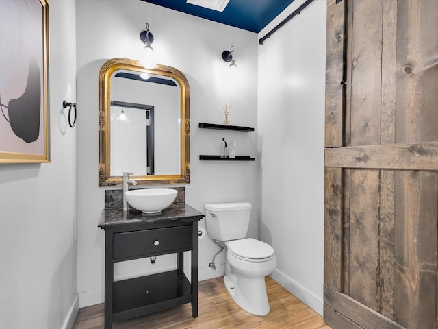 1122 Jackson St Unit 1103, Dallas, TX 75202 - bathroom featuring vanity and wood finished floors
