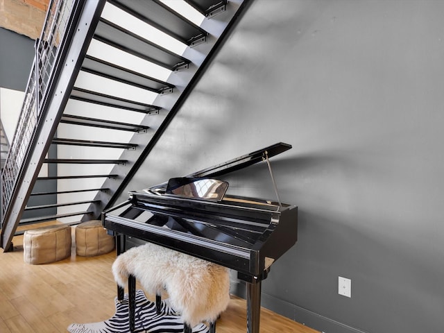 1122 Jackson St Unit 1103, Dallas, TX 75202 - sitting room with wood finished floors and stairway