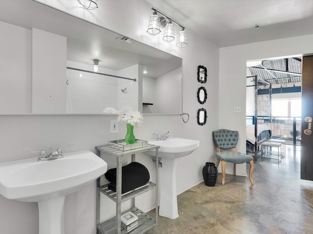 1122 Jackson St Unit 1103, Dallas, TX 75202 - bathroom with finished concrete flooring and tiled shower