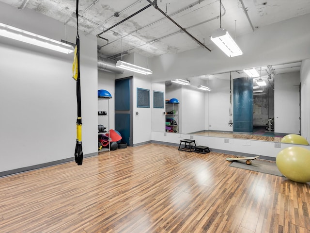 1122 Jackson St Unit 1103, Dallas, TX 75202 - exercise area with hardwood / wood-style floors and baseboards