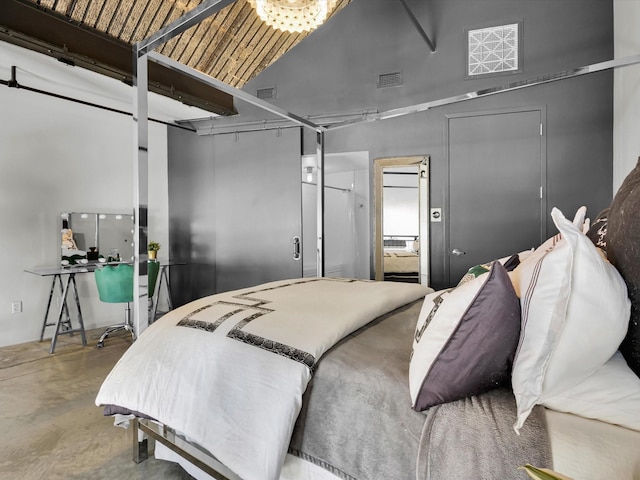 1122 Jackson St Unit 1103, Dallas, TX 75202 - bedroom featuring concrete flooring and high vaulted ceiling