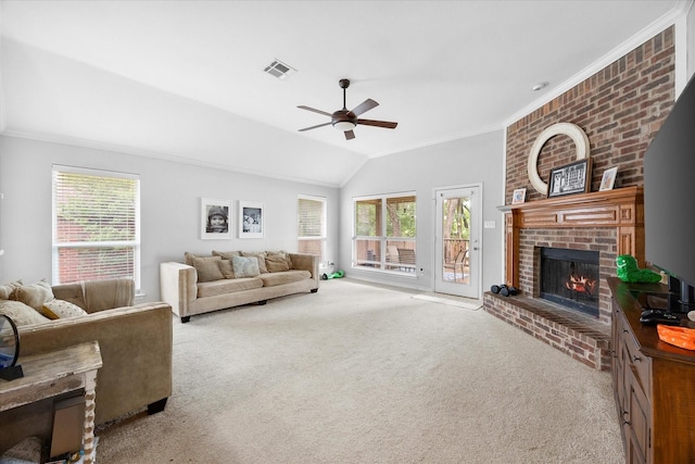 1365 Clear Meadow Ct, Rockwall, TX 75087 - carpeted living room featuring a brick fireplace, ceiling fan, crown molding, plenty of natural light, and vaulted ceiling