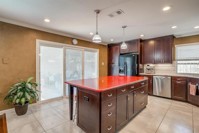 609 Huntington Ct, Grapevine, TX 76051 - kitchen with dishwasher, black fridge with ice dispenser, crown molding, light tile patterned floors, and pendant lighting