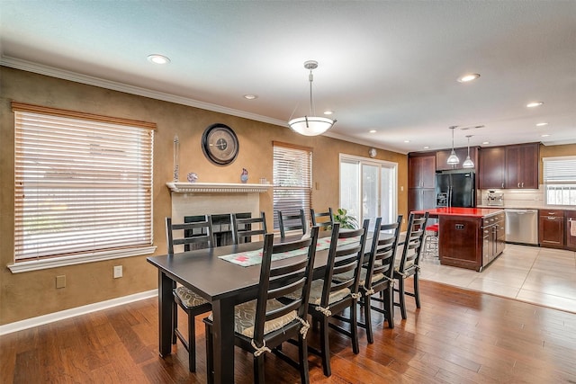 609 Huntington Ct, Grapevine, TX 76051 - dining room featuring recessed lighting, light wood finished floors, and ornamental molding