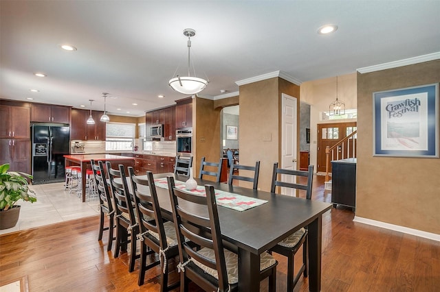 609 Huntington Ct, Grapevine, TX 76051 - dining room featuring recessed lighting, crown molding, and light wood-type flooring
