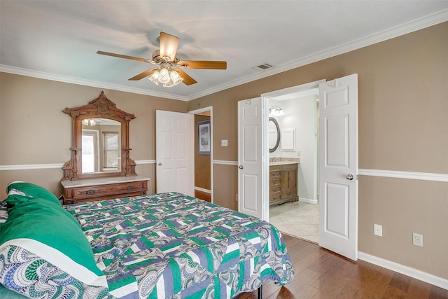609 Huntington Ct, Grapevine, TX 76051 - bedroom with wood finished floors, ceiling fan, crown molding, and ensuite bath