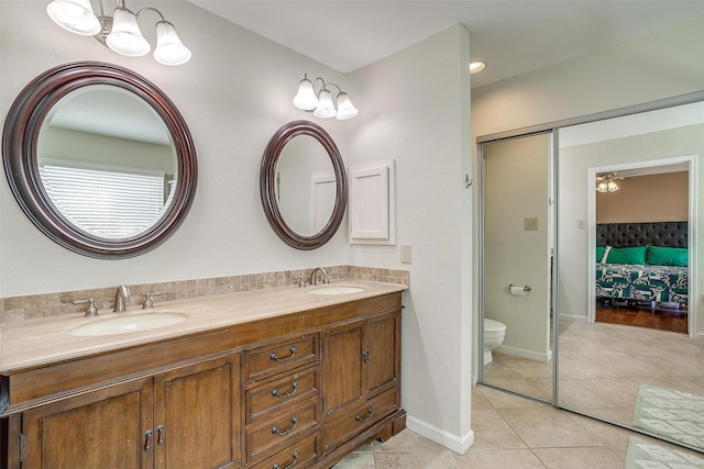 609 Huntington Ct, Grapevine, TX 76051 - bathroom with double vanity and tile patterned floors