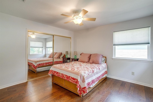 609 Huntington Ct, Grapevine, TX 76051 - bedroom featuring multiple windows, a closet, and wood finished floors