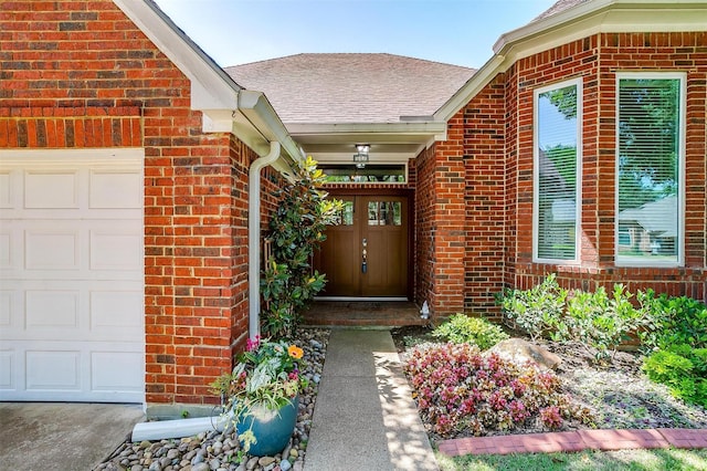 609 Huntington Ct, Grapevine, TX 76051 - property entrance featuring brick siding, a shingled roof, and an attached garage
