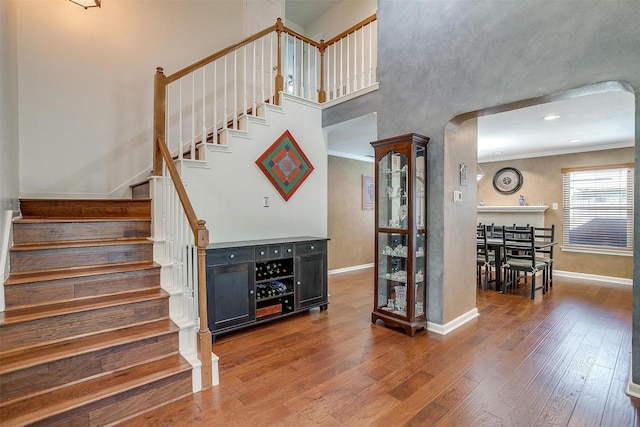609 Huntington Ct, Grapevine, TX 76051 - stairway with wood finished floors and crown molding