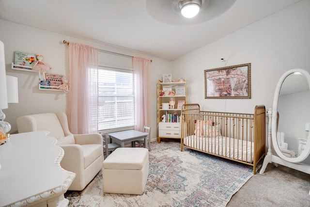 5712 Hudson St, Dallas, TX 75206 - carpeted bedroom featuring a nursery area and ceiling fan