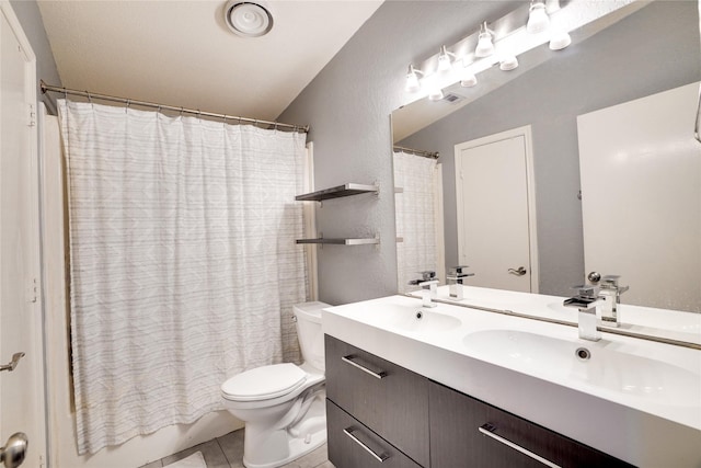 5712 Hudson St, Dallas, TX 75206 - full bathroom with double vanity, tile patterned flooring, and shower / tub combo with curtain