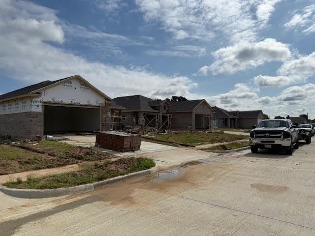 10105 Budtime Ln, Dallas, TX 75217 - unfinished property with concrete driveway and an attached garage