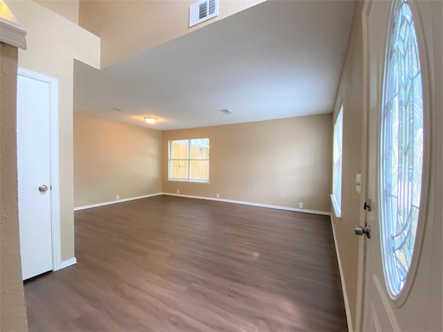 1125 Greenbend Dr, Denton, TX 76210 - spare room with dark wood-style floors and baseboards