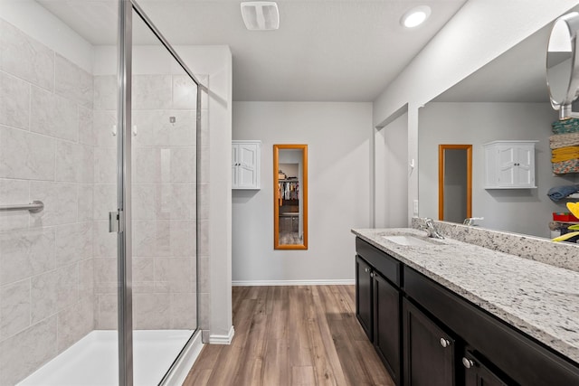 7209 Guadalupe Rd, China Spring, TX 76633 - full bathroom with vanity, a shower stall, wood finished floors, and recessed lighting
