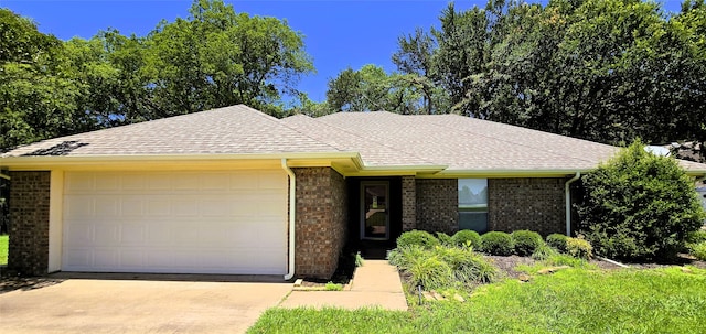 170 N Meadowbrook Dr, Pottsboro, TX 75076 - view of front of home featuring driveway, brick siding, a garage, and roof with shingles