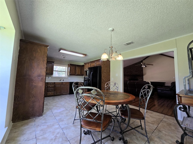 170 N Meadowbrook Dr, Pottsboro, TX 75076 - dining area with ceiling fan, a chandelier, a textured ceiling, and light tile patterned flooring