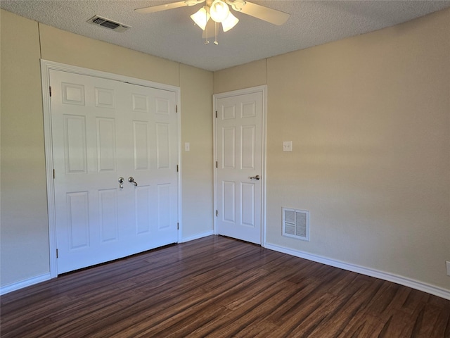170 N Meadowbrook Dr, Pottsboro, TX 75076 - unfurnished bedroom with dark wood-type flooring, a ceiling fan, and a textured ceiling