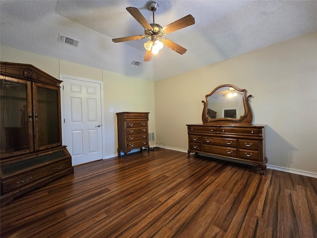 170 N Meadowbrook Dr, Pottsboro, TX 75076 - bedroom featuring dark wood-style floors, a textured ceiling, and a ceiling fan