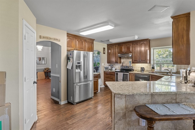 TBD Cleburne Highway, Granbury, TX 76049 - kitchen with stainless steel refrigerator with ice dispenser, electric range, dishwasher, light stone counters, and arched walkways
