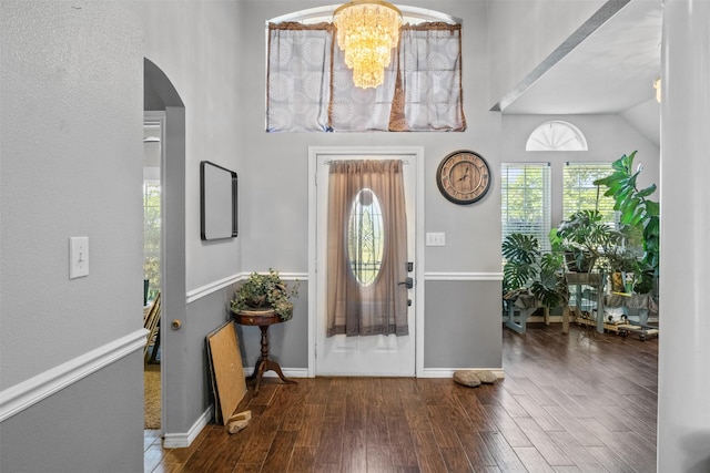 TBD Cleburne Highway, Granbury, TX 76049 - foyer entrance with arched walkways, wood finished floors, plenty of natural light, a chandelier, and a towering ceiling