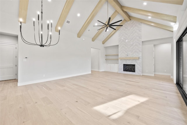 232 Bel Grand Rd, Haslet, TX 76052 - unfurnished living room with a high end fireplace, beamed ceiling, light wood finished floors, ceiling fan, and recessed lighting