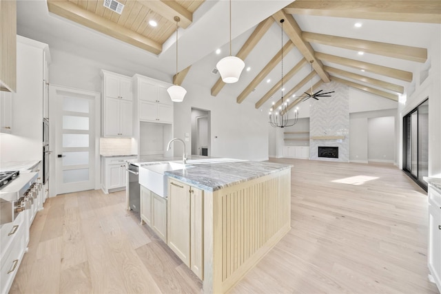 232 Bel Grand Rd, Haslet, TX 76052 - kitchen with a large fireplace, light wood finished floors, light stone countertops, recessed lighting, and high vaulted ceiling