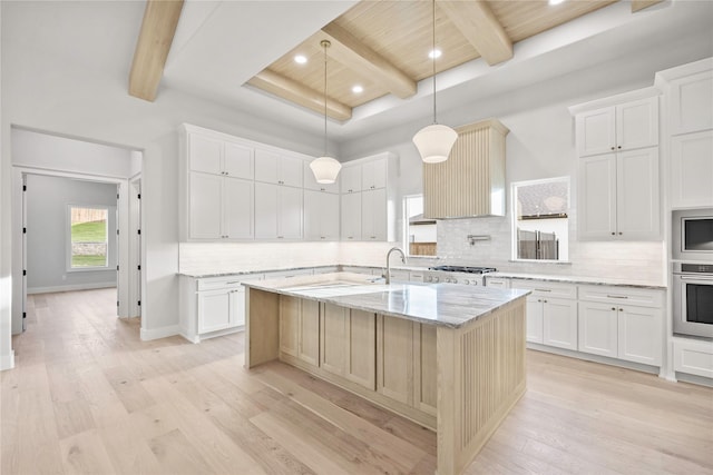 232 Bel Grand Rd, Haslet, TX 76052 - kitchen featuring appliances with stainless steel finishes, light wood-style floors, decorative backsplash, a center island with sink, and recessed lighting
