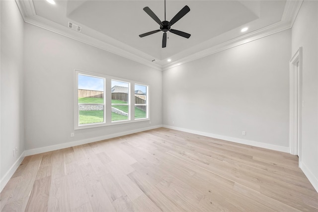232 Bel Grand Rd, Haslet, TX 76052 - unfurnished room featuring a tray ceiling, ornamental molding, recessed lighting, light wood-style floors, and ceiling fan
