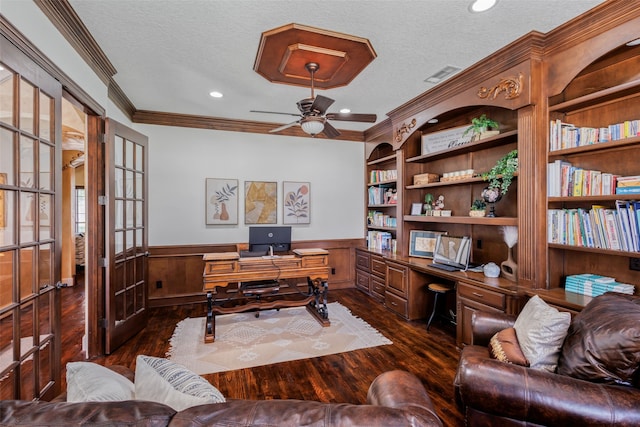 5101 Oak Timbers Ct, Colleyville, TX 76034 - office with dark wood-style flooring, a ceiling fan, a textured ceiling, a wainscoted wall, and ornamental molding