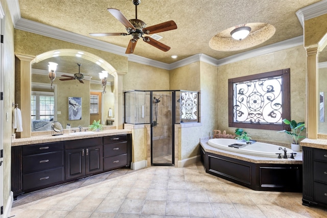5101 Oak Timbers Ct, Colleyville, TX 76034 - bathroom featuring ceiling fan, vanity, a shower stall, a bath, and ornamental molding