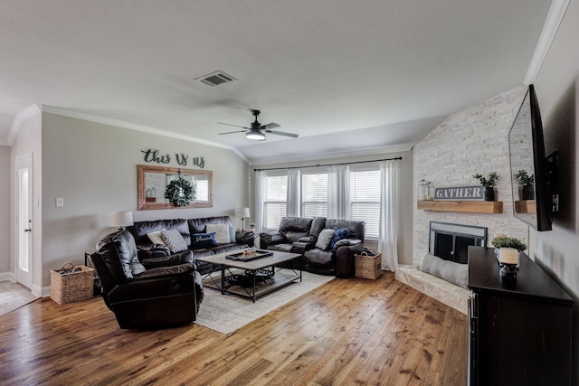 785 Crockett Dr, Lavon, TX 75166 - living area featuring crown molding, wood-type flooring, a ceiling fan, a fireplace, and lofted ceiling