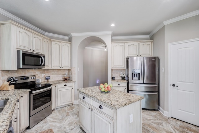 785 Crockett Dr, Lavon, TX 75166 - kitchen with appliances with stainless steel finishes, crown molding, light marble finish flooring, arched walkways, and tasteful backsplash