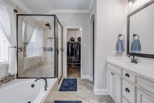 785 Crockett Dr, Lavon, TX 75166 - full bathroom with a shower stall, crown molding, vanity, a garden tub, and a walk in closet