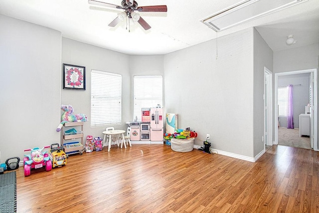 7400 Howling Coyote Ln, Fort Worth, TX 76131 - game room with attic access, a ceiling fan, and wood finished floors