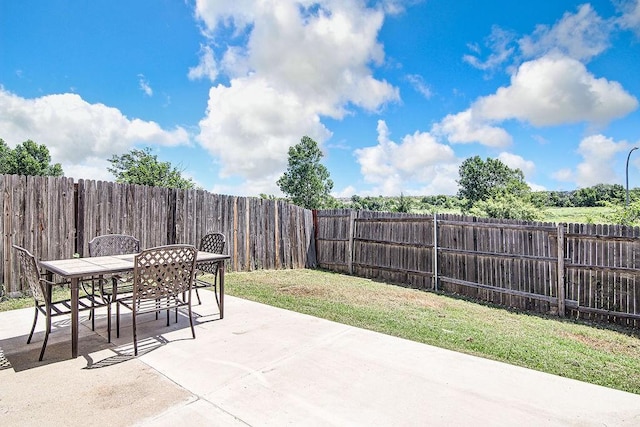 7400 Howling Coyote Ln, Fort Worth, TX 76131 - fenced backyard with a patio area and outdoor dining area