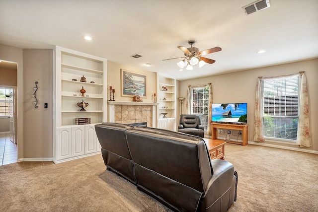 9513 Tiger Dr, Plano, TX 75025 - living room featuring light colored carpet, ceiling fan, plenty of natural light, a tile fireplace, and recessed lighting