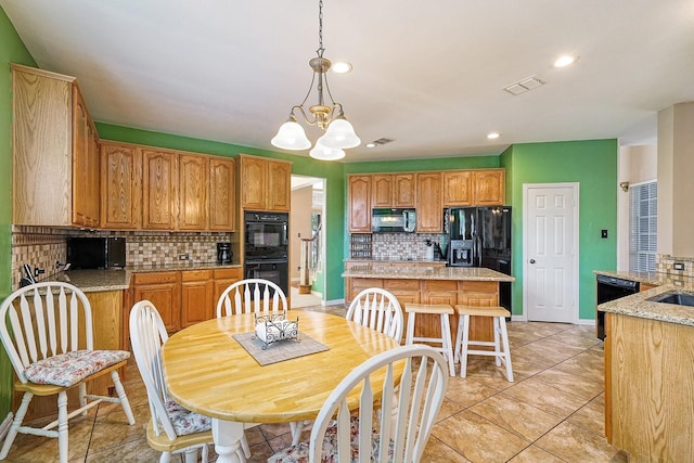 9513 Tiger Dr, Plano, TX 75025 - dining area featuring a chandelier, recessed lighting, and light tile patterned floors