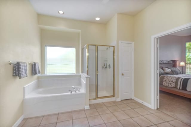 9513 Tiger Dr, Plano, TX 75025 - full bathroom featuring connected bathroom, a garden tub, tile patterned floors, and a shower stall