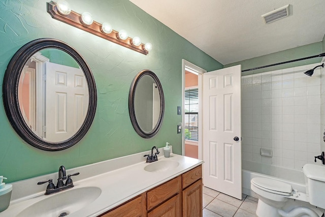 9513 Tiger Dr, Plano, TX 75025 - full bath with tile patterned flooring, double vanity, bathing tub / shower combination, and a textured wall